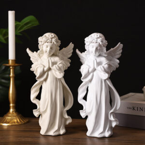 christmas ornament angels​,two white girls close your eyes and puts your hand together in front on the chest