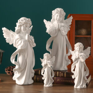 four white girls angel christmas crafts on the tabel,put them hands together in front of your chest