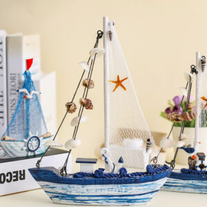 Resin home decoration crafts, a blue and white sailboat with several shells hanging on it and a red envelope five-pointed starfish hanging on the sail